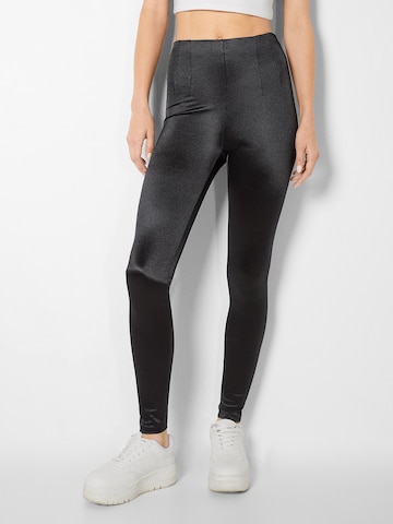 Bershka Skinny Leggings in Black: front