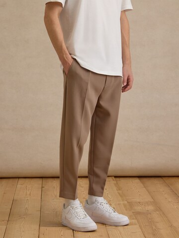 DAN FOX APPAREL Tapered Pleated Pants 'Toni' in Beige: front