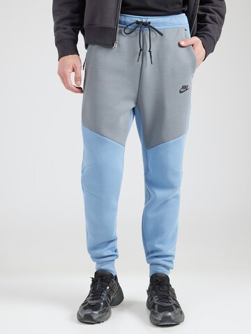 Nike Sportswear Tapered Broek 'TCH FLC' in Blauw: voorkant