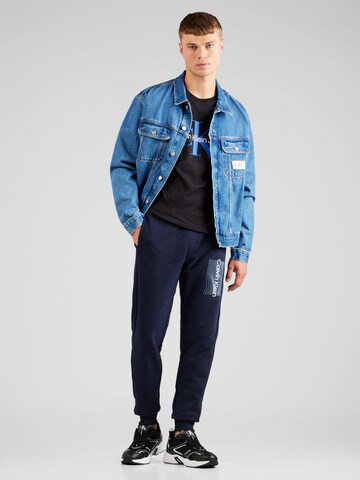 Calvin Klein Tapered Housut värissä sininen