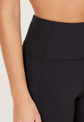 Athlecia Skinny Workout Pants 'Elli' in Black
