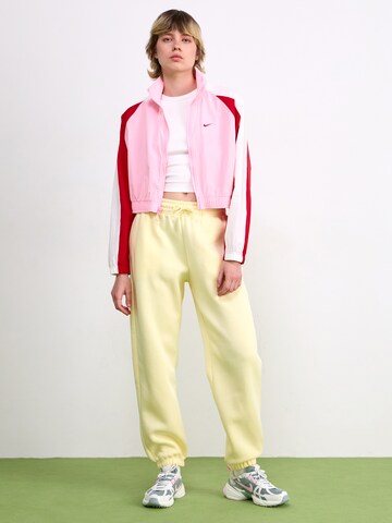 Nike Sportswear Tapered Pants 'PHNX FLC' in Yellow