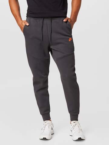 Nike Sportswear Tapered Pants in Grey: front