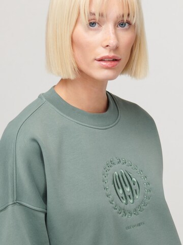 Sweat-shirt 'CLIQUE' UNFOLLOWED x ABOUT YOU en vert