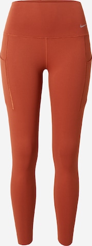 Skinny Pantaloni sport 'UNIVERSA' de la NIKE pe portocaliu: față
