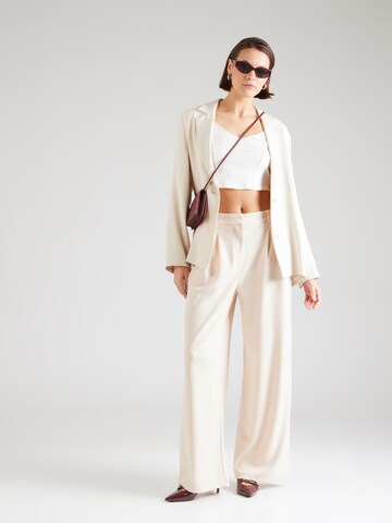 ABOUT YOU Wide leg Trousers 'Sarah' in Beige