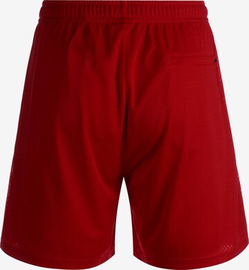 Loosefit Pantaloni sportivi di K1X in rosso