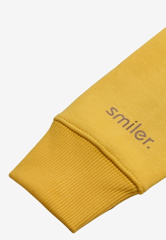 Sweat 'Cuddle' smiler. en jaune