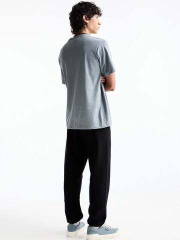 Tapered Pantaloni di Pull&Bear in nero