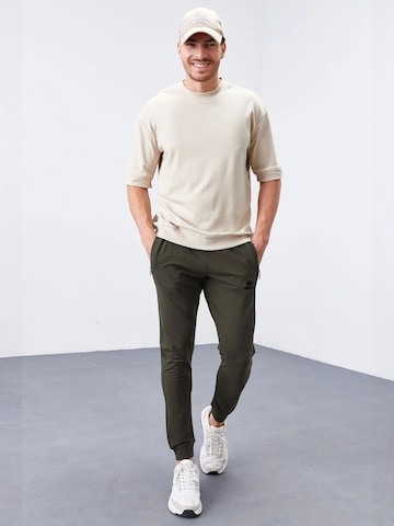 Tommy Life - Skinny Calças de desporto 'Jogginghose' em verde