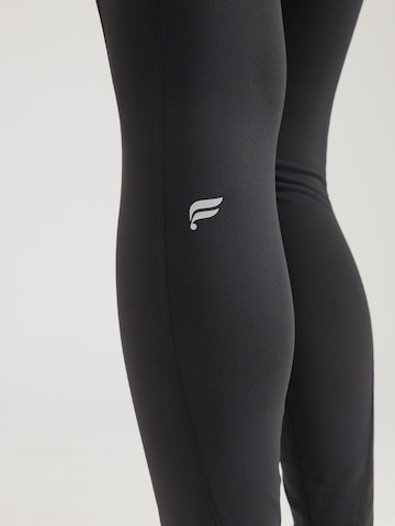 Fabletics Skinny Sportovní kalhoty 'Oasis' – černá