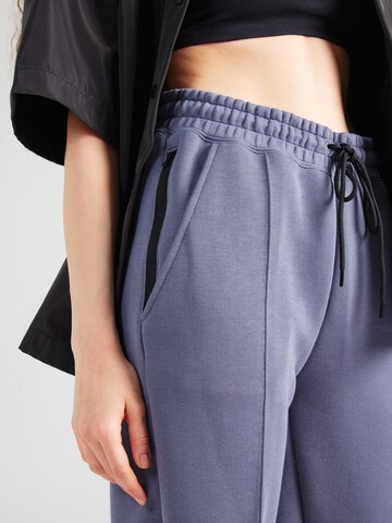 Nike Sportswear Tapered Hose 'TCH FLC' in Lila