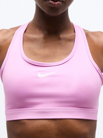 NIKE Bustier Biustonosz sportowy 'SWSH' w kolorze różowy