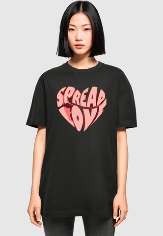 T-shirt oversize 'Hugs & Love - Spread Love' Merchcode en noir : devant