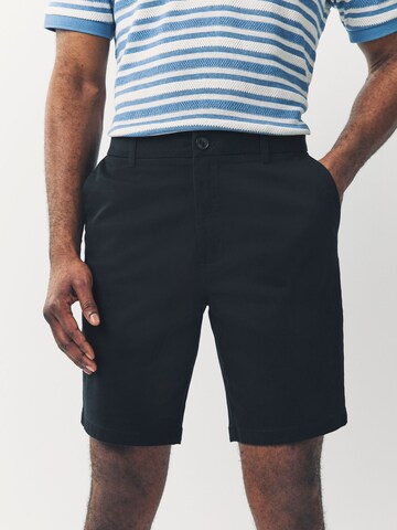 Next Slimfit Chinobyxa i blå