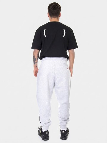 Karl Kani Baggy Bukser 'Men's Signature Sweat Pants' i grå