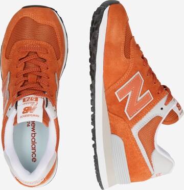 new balance حذاء رياضي بلا رقبة '574' بلون برتقالي