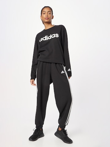 ADIDAS SPORTSWEAR Αθλητική μπλούζα φούτερ 'Essentials Linear' σε μαύρο