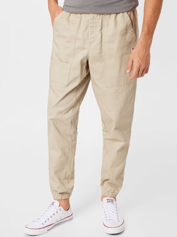 PUMA Tapered Pants 'Downtown' in Beige: front