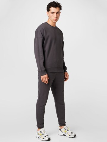 SikSilk Sweatsuit in Black: front