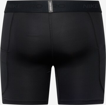 NIKE Skinny Sporthose in Schwarz