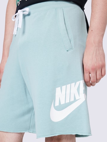 Nike Sportswear Loosefit Kalhoty 'Club Alumini' – modrá
