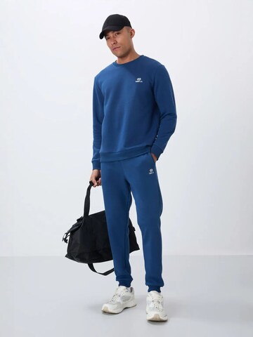 Tommy Life Joggingpak in Blauw: voorkant