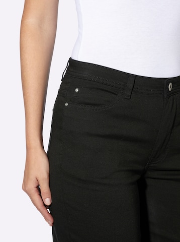 heine - Slimfit Calças de ganga em preto