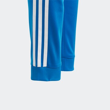 ADIDAS ORIGINALS Tapered Broek 'Adicolor' in Blauw