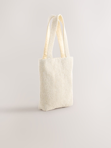 Next Ostoskassi värissä valkoinen