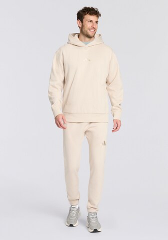 ADIDAS SPORTSWEAR Tapered Workout Pants in Yellow