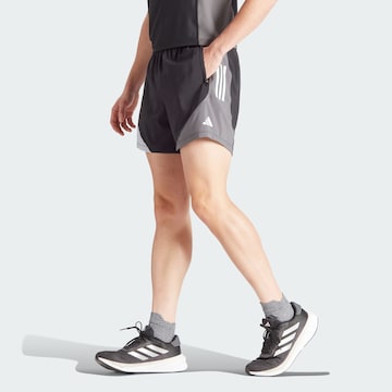 ADIDAS PERFORMANCE - Regular Calças de desporto 'Own The Run' em preto: frente