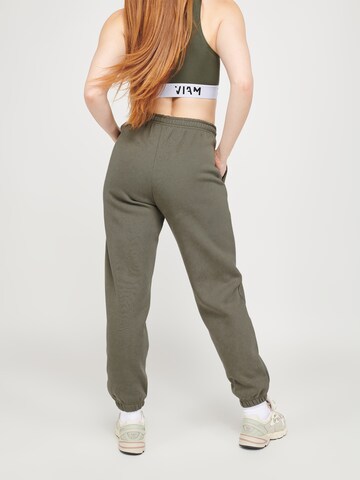 ABOUT YOU x VIAM Studio Regular Trousers 'Motivation' in Green: back