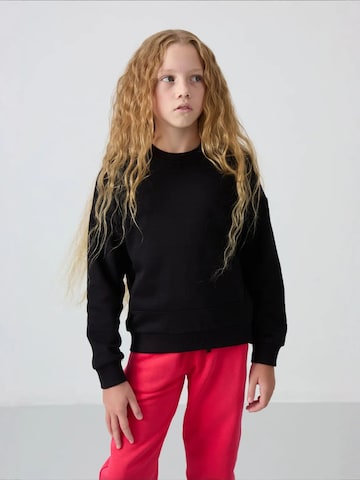 Tommy Life Bluzka sportowa 'TOMMY Jugend-Unisex-Sweatshirt Aus Baumwollmischung' w kolorze niebieski