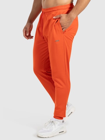 Effilé Pantalon de sport 'Nilo' Smilodox en orange