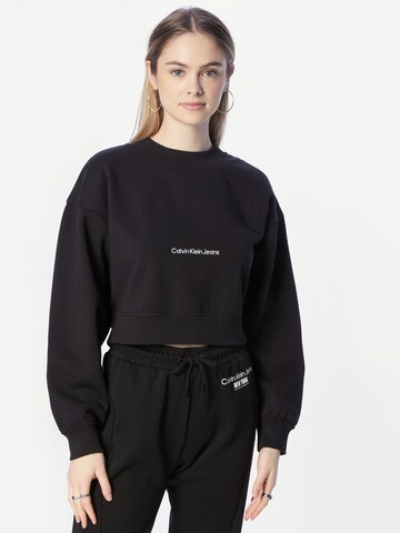 Sweat-shirt Calvin Klein Jeans en noir : devant