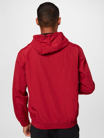 Champion Authentic Athletic Apparel Tussenjas in Rood