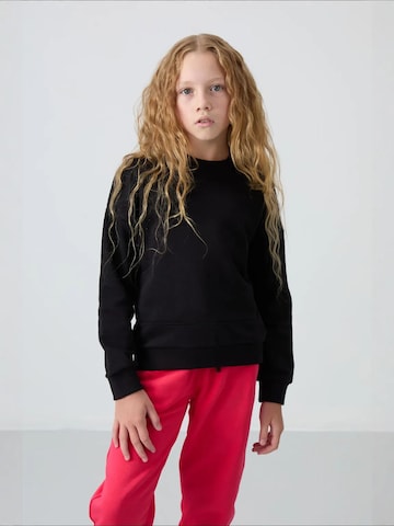 Tommy Life - Sweatshirt em preto: frente