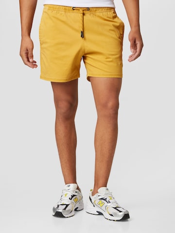 Superdry Normální Kalhoty – žlutá: přední strana