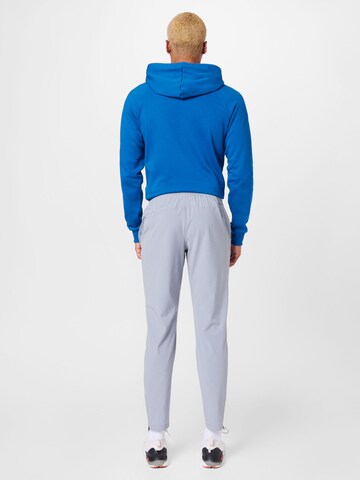 UNDER ARMOUR - Regular Calças de desporto em cinzento