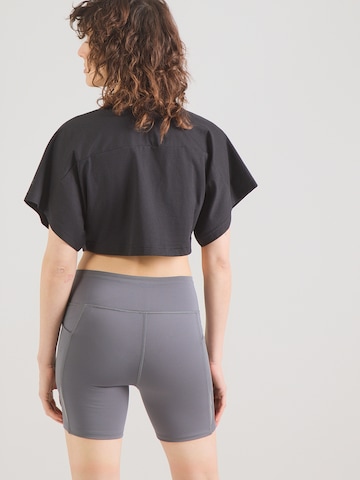 UNDER ARMOUR Koszulka funkcyjna w kolorze czarny