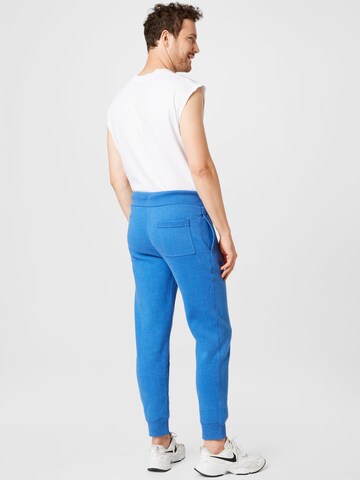 Superdry Zúžený Kalhoty – modrá