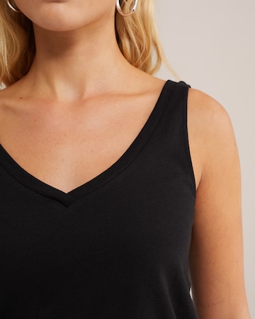 Top de la WE Fashion pe negru