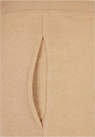 Tapered Pantaloni di Urban Classics in beige