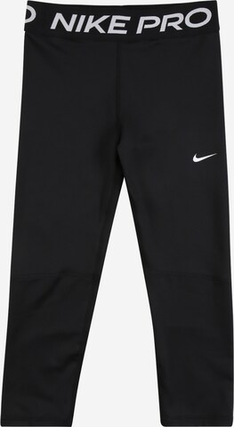 NIKE Skinny Workout Pants in Black: front