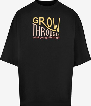 Merchcode Shirt 'Spring - Grow Through' in Schwarz: predná strana