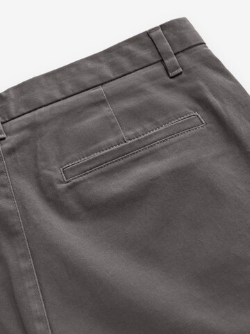 Skinny Pantaloni chino di Next in grigio