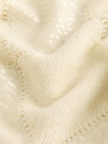 Next Neulepaita värissä beige