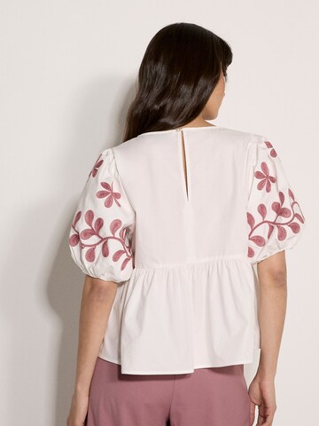 Apricot Floral Embroidered Peplum Top ' ' in Beige