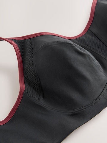 Next Bustier Urheilurintaliivit värissä musta
